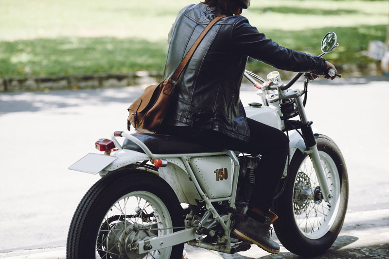 riding motorcycle along road